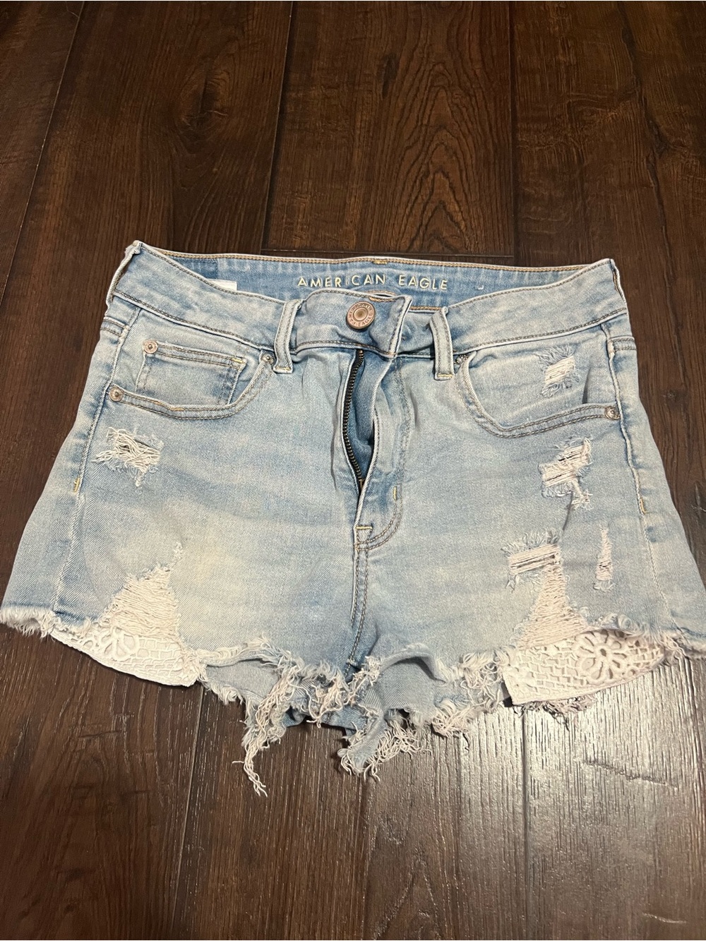 American Eagle Outfitters Light Wash Distressed Denim Shorts with Lace Trim
